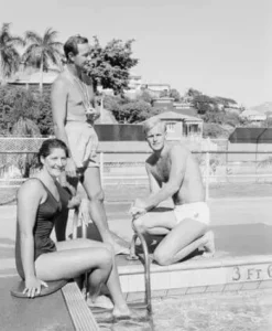 Dawn Fraser, Lorraine Crapp and Jon Henricks together infront of a pool