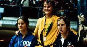 Old photo of 3 swimmers