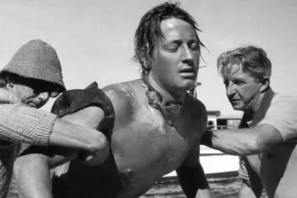 John Coutts being pulled out of the water