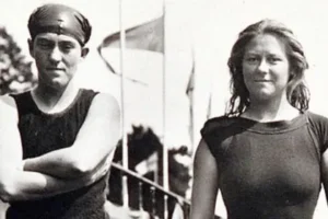 Old film image of two people standing