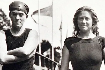 Old film image of two people standing