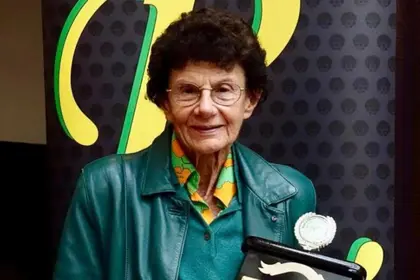 Ursula Carlile holding trophy
