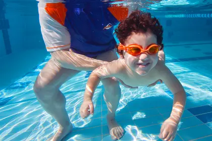 Smiling boy underwater