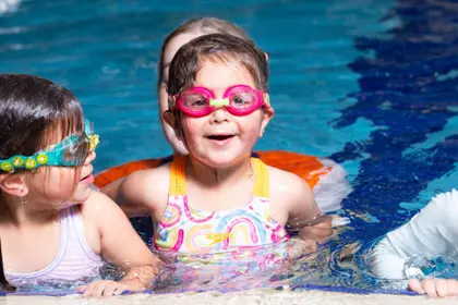 Smiling child in the pool