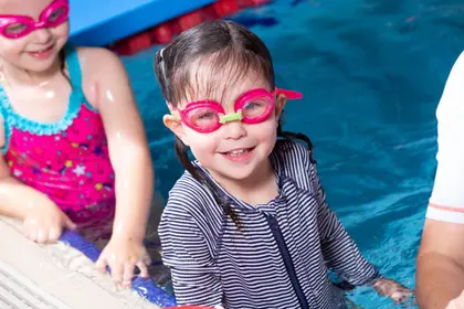 Smiling girl in the pool