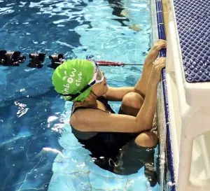 Child getting ready to start a swimming race