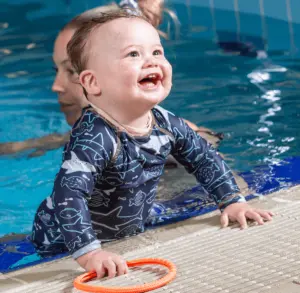 Baby smiling in the pool