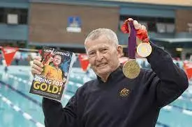 Laurie with his book going for gold