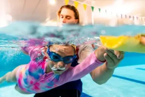 Underwater image of girl learning to swim