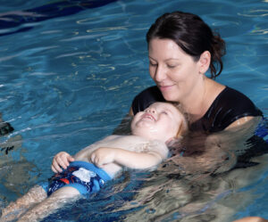 Baby Swimming lesson back floating at Carlile