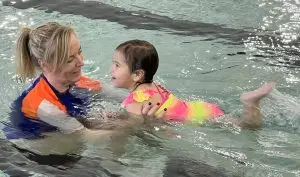 Student and teacher in the pool