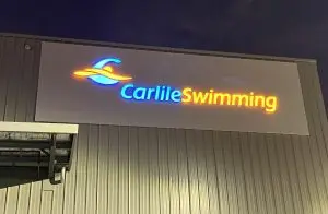Carlile Swimming sign at night