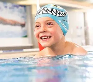 Student smiling in the pool