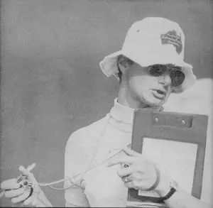Ursula Carlile holding stopwatch