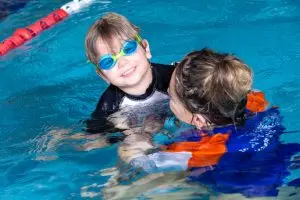 Teacher and student in the pool together