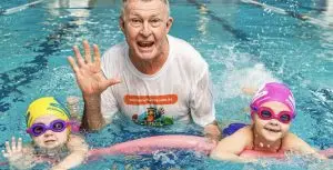 Laurie Lawrence in the pool with students