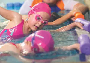 Students practicing in the pool