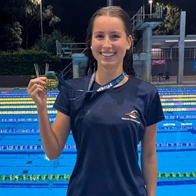 Carlile Swim Team champion with a gold medal